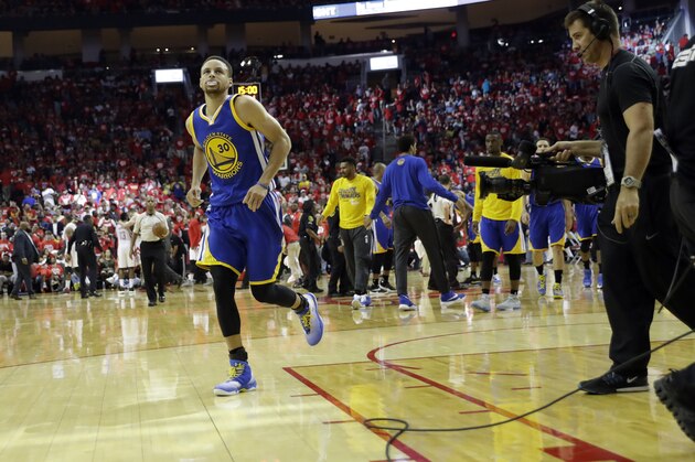 Golden State Warriors' Stephen Curry jogs off the court at the end of the first half in Game 4 of a first-round NBA basketball playoff series, Sunday against the Houston Rockets, April 24, 2016, in Houston. (AP Photo/David J. Phillip)