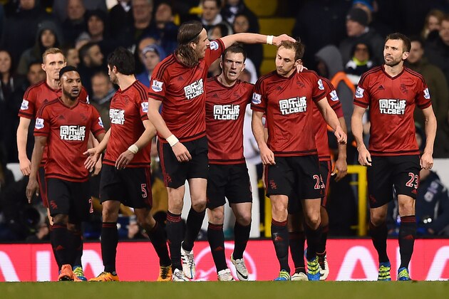 West Bromwich Albion's English defender Craig Dawson (2nd R) is congratulated after scoring his team's first goal during the English Premier League football match between Tottenham Hotspur and West Bromwich Albion at White Hart Lane in London, on April 25, 2016. / AFP / BEN STANSALL / RESTRICTED TO EDITORIAL USE. No use with unauthorized audio, video, data, fixture lists, club/league logos or 'live' services. Online in-match use limited to 75 images, no video emulation. No use in betting, games or single club/league/player publications.  /         (Photo credit should read BEN STANSALL/AFP/Getty Images)
