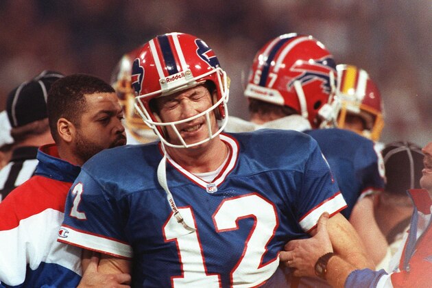 Buffalo Bills quarterback Jim Kelly grimaces during the Bills 37-24 in Super Bowl XXVI against the Washington Redskins in Minneapolis on Jan. 27, 1992. Kelly is expected to announce his retirement Friday Jan. 31, 1997 at a news conference called by the Buffalo Bills.  Sources have said since last week that Kelly, unable to reach agreement with the Bills on a new contract deal, will retire after 11 years with Buffalo.(AP Photo/Rusty Kennedy)