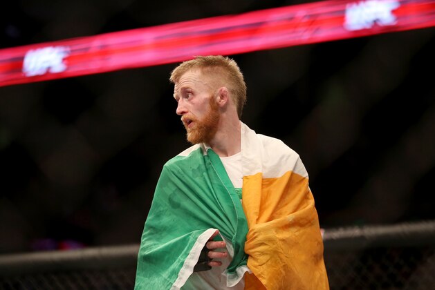 Paddy Holohan celebrates a win against Shane Howell during their fight at UFC Fight Night Boston, Sunday, January 18, 2015 in Boston.  Holohan won via decision. (AP Photo/Gregory Payan)