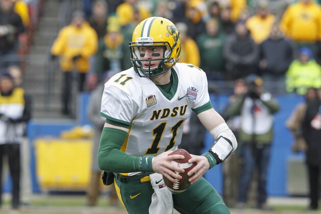 North Dakota State quarterback Carson Wentz (11) carries the ball during the FCS Championship NCAA college football game against Illinois State Saturday, Jan. 10, 2015, in Frisco, Texas.   North Dakota State won the game 29-27 for their fourth straight national championship.  (AP Photo/Tim Sharp)