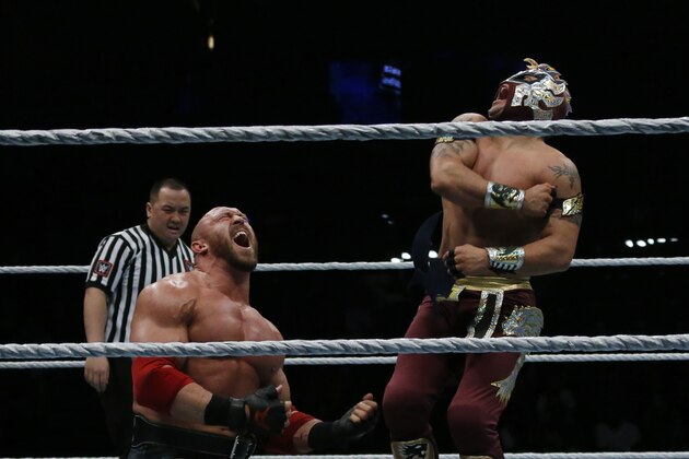 Wrestlers Ryback and Kalisto fight during a show at the AccorHotels Arena in Paris, as part of the WrestleMania Revenge Tour, the World Wrestling Entertainment (WWE) European tour, on April 22, 2016. / AFP / THOMAS SAMSON        (Photo credit should read THOMAS SAMSON/AFP/Getty Images)