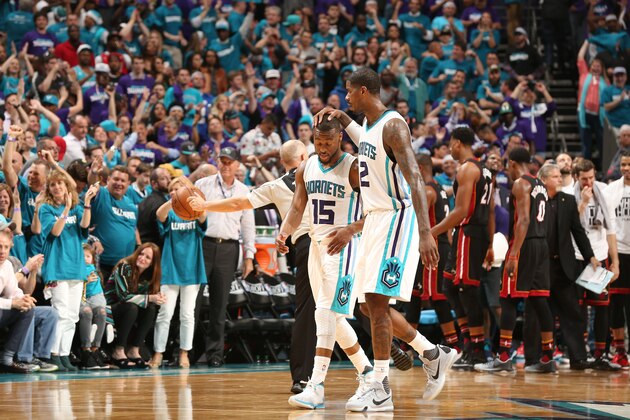 CHARLOTTE, NC - APRIL 25: Marvin Williams #2 and Kemba Walker #15 of the Charlotte Hornets celebrate after the win against the Miami Heat for Game Four of the Eastern Conference Quarterfinals during the 2016 NBA Playoffs on April 25, 2016 at Time Warner Cable Arena in Charlotte, North Carolina. NOTE TO USER: User expressly acknowledges and agrees that, by downloading and or using this Photograph, user is consenting to the terms and conditions of the Getty Images License Agreement. Mandatory Copyright Notice: Copyright 2016 NBAE (Photo by Kent Smith/NBAE via Getty Images)