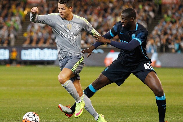 MELBOURNE, AUSTRALIA - JULY 24: Yaya Toure of Manchester City tackles Cristiano Ronaldo of Real Madrid during the International Champions Cup match between Real Madrid and Manchester City at Melbourne Cricket Ground on July 24, 2015 in Melbourne, Australia.  (Photo by Daniel Pockett/Getty Images for International Champions Cup)