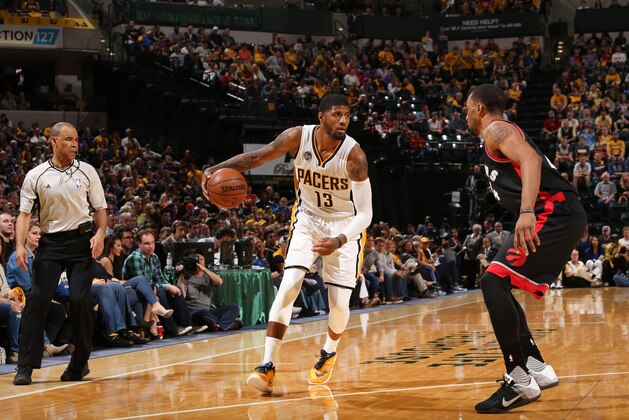 INDIANAPOLIS, IN - APRIL 23: Paul George #13 of the Indiana Pacers defends the ball against the Toronto Raptors during Game Three of the Eastern Conference Quarterfinals during the 2016 NBA Playoffs on April 23, 2016 at Bankers Life Fieldhouse in Indianapolis, Indiana. NOTE TO USER: User expressly acknowledges and agrees that, by downloading and or using this Photograph, user is consenting to the terms and conditions of the Getty Images License Agreement. Mandatory Copyright Notice: Copyright 2016 NBAE (Photo by Gary Dineen/NBAE via Getty Images)