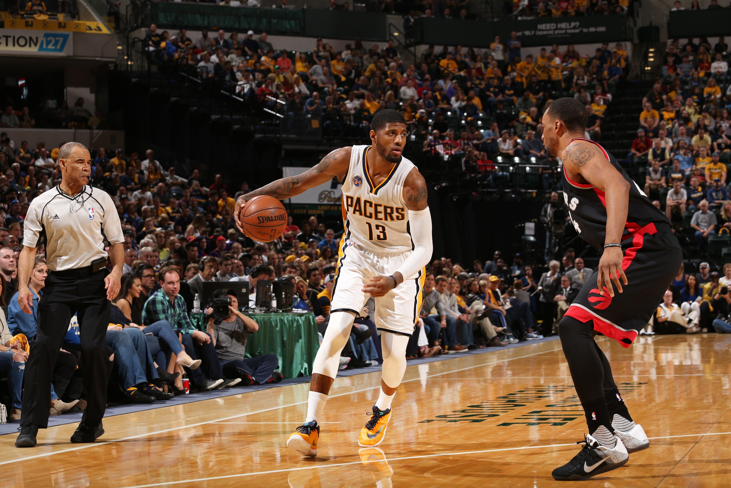 INDIANAPOLIS, IN - APRIL 23: Paul George #13 of the Indiana Pacers defends the ball against the Toronto Raptors during Game Three of the Eastern Conference Quarterfinals during the 2016 NBA Playoffs on April 23, 2016 at Bankers Life Fieldhouse in Indianapolis, Indiana. NOTE TO USER: User expressly acknowledges and agrees that, by downloading and or using this Photograph, user is consenting to the terms and conditions of the Getty Images License Agreement. Mandatory Copyright Notice: Copyright 2016 NBAE (Photo by Gary Dineen/NBAE via Getty Images)
