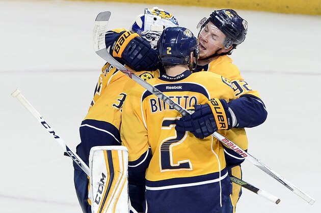 Nashville Predators' Ryan Johansen, top right, and Anthony Bitetto (2) celebrate with goalie Pekka Rinne, left, of Finland, after the Predators defeated the Anaheim Ducks 3-1 in Game 6 in an NHL hockey first-round Stanley Cup playoff series Monday, April 25, 2016, in Nashville, Tenn.  The Predators even the series 3-3. (AP Photo/Mark Zaleski)