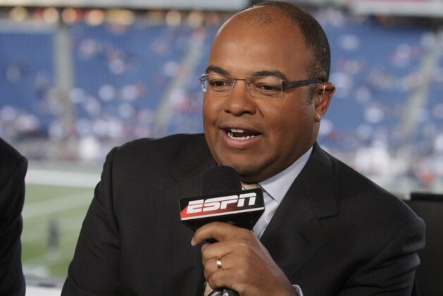 In this Sept. 14, 2009 photo, ESPN broadcaster Mike Tirico speaks before an NFL football game between the New England Patriots and the Buffalo Bills in Foxborough, Mass. A person familiar with the move said Tirico is leaving ESPN and ABC Sports this summer when his contract expires to work for NBC. The person spoke Monday, April 25, 2016, to The Associated Press on condition of anonymity because neither network had made an announcement about the broadcaster. (AP Photo/Steven Senne)