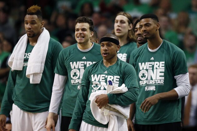Boston Celtics' Isaiah Thomas, center, watches with teammate from the bench during the fourth quarter in game 4 of a first-round NBA basketball playoff series against the Atlanta Hawks in Boston, Sunday, April, 24, 2016. The Celtics won 104-95 in overtime. (AP Photo/Michael Dwyer)