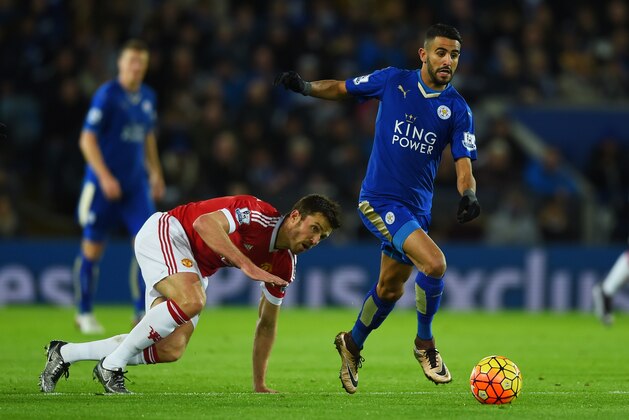 LEICESTER, ENGLAND - NOVEMBER 28: Riyad Mahrez of Leicester City and Michael Carrick of Manchester United compete for the ball during the Barclays Premier League match between Leicester City and Manchester United at The King Power Stadium on November 28, 2015 in Leicester, England.  (Photo by Laurence Griffiths/Getty Images)