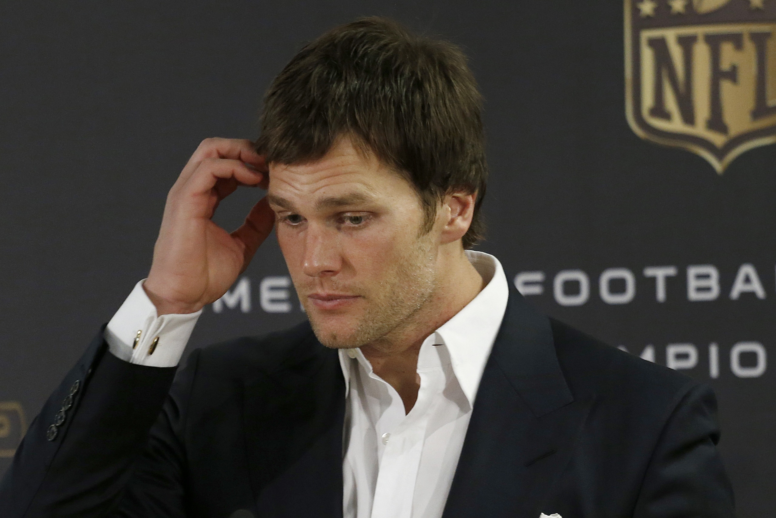 New England Patriots quarterback Tom Brady answers questions during a press conference following the NFL football AFC Championship game between the Denver Broncos and the New England Patriots, Sunday, Jan. 24, 2016, in Denver. The Broncos defeated the Patriots 20-18 to advance to the Super Bowl. (AP Photo/Joe Mahoney)
