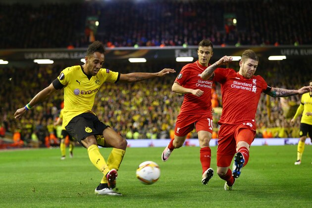 LIVERPOOL, ENGLAND - APRIL 14:  Pierre-Emerick Aubameyang of Borussia Dortmund is challenged by Alberto Moreno of Liverpool during the UEFA Europa League quarter final, second leg match between Liverpool and Borussia Dortmund at Anfield on April 14, 2016 in Liverpool, United Kingdom.  (Photo by Clive Brunskill/Getty Images)