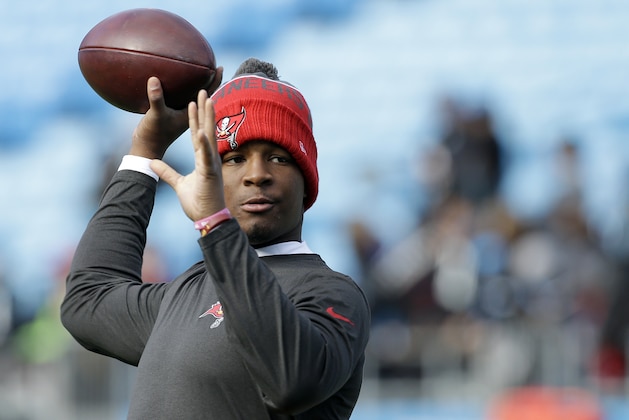 Tampa Bay Buccaneers' Jameis Winston tosses a pass during warm ups before an NFL football game against the Carolina Panthers in Charlotte, N.C., Sunday, Jan. 3, 2016. The Panthers won 38-10. (AP Photo/Bob Leverone)