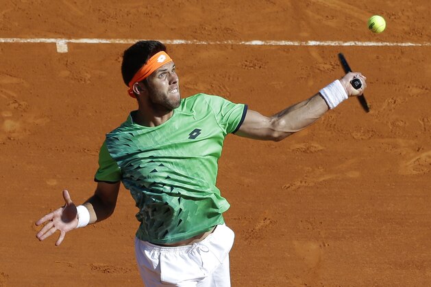 Jiri Vesely of Czech Republic plays a return to  Novak Djokovic of Serbia during their match of the Monte Carlo Tennis Masters tournament in Monaco, Wednesday, April 13, 2016. (AP Photo/Lionel Cironneau)