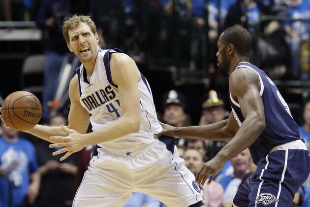 Dallas Mavericks forward Dirk Nowitzki (41) looks to pass against Oklahoma City Thunder forward Serge Ibaka (9) during the first half in Game 3 of a first-round NBA basketball playoff series Thursday, April 21, 2016, in Dallas. (AP Photo/LM Otero)