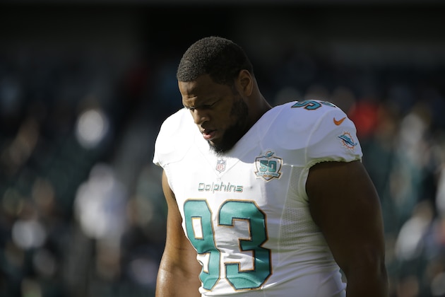 Miami Dolphins' Ndamukong Suh walks the field during warm-ups before an NFL football game against the Philadelphia Eagles, Sunday, Nov. 15, 2015, in Philadelphia. (AP Photo/Matt Rourke)