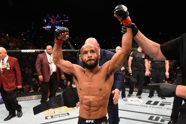 LAS VEGAS, NV - APRIL 23:  Demetrious Johnson celebrates his TKO victory over Henry Cejudo in their flyweight championship bout during the UFC 197 event inside MGM Grand Garden Arena on April 23, 2016 in Las Vegas, Nevada.  (Photo by Josh Hedges/Zuffa LLC/Zuffa LLC via Getty Images)