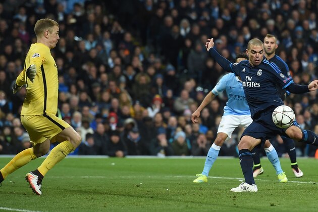 Manchester City's English goalkeeper Joe Hart (L) spreads himself wide to  save a close-range shot from Real Madrid's Portuguese defender Pepe (R) during the UEFA Champions League semi-final first leg football match between Manchester City and Real Madrid at the Etihad Stadium in Manchester, northwest England, on April 26, 2016. / AFP / PAUL ELLIS        (Photo credit should read PAUL ELLIS/AFP/Getty Images)