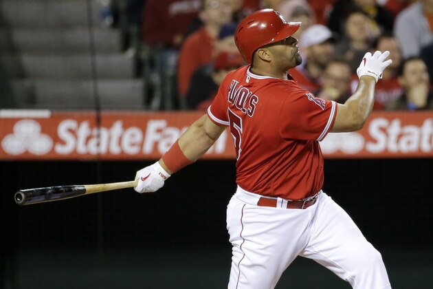 Los Angeles Angels' Albert Pujols watches his home run against the Kansas City Royals during the fifth inning of a baseball game in Anaheim, Calif., Monday, April 25, 2016. (AP Photo/Chris Carlson)