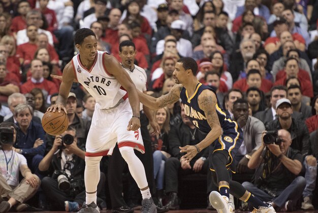 Apr 26, 2016; Toronto, Ontario, CAN; Toronto Raptors guard DeMar DeRozan (10) controls the ball against Indiana Pacers guard George Hill (3) during the second quarter in game five of the first round of the 2016 NBA Playoffs at Air Canada Centre. Mandatory Credit: Nick Turchiaro-USA TODAY Sports