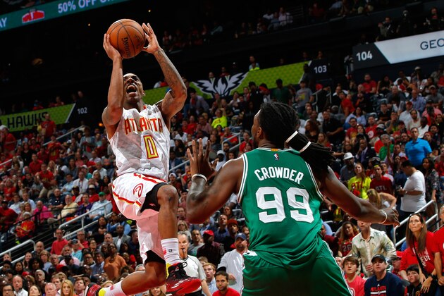 ATLANTA, GA - APRIL 26:  Jeff Teague #0 of the Atlanta Hawks shoots against Jae Crowder #99 of the Boston Celtics in Game Five of the Eastern Conference Quarterfinals during the 2016 NBA Playoffs at Philips Arena on April 26, 2016 in Atlanta, Georgia.  NOTE TO USER User expressly acknowledges and agrees that, by downloading and or using this photograph, user is consenting to the terms and conditions of the Getty Images License Agreement.  (Photo by Kevin C. Cox/Getty Images)