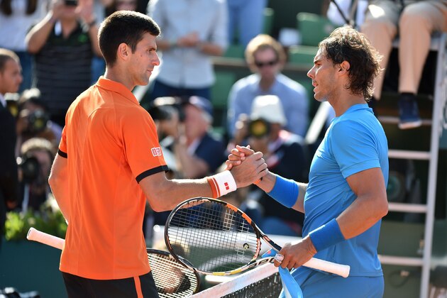 Spain's Rafael Nadal (R) shakes hands with Serbia's Novak Djokovic at the end of their men's quarter final match of the Roland Garros 2015 French Tennis Open in Paris on June 3, 2015. AFP PHOTO / PASCAL GUYOT        (Photo credit should read PASCAL GUYOT/AFP/Getty Images)