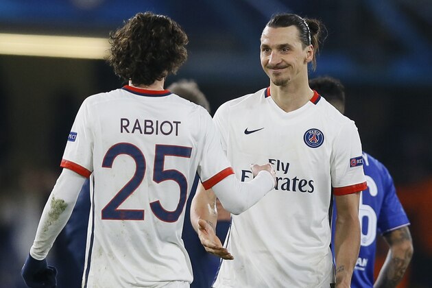 PSG's Zlatan Ibrahimovic, right, and PSG's Adrien Rabiot, left, who both scored a goal, celebrate after the round of sixteen second leg Champions League soccer match between Chelsea and Paris Saint-Germain at Stamford Bridge stadium in London, Wednesday, March 9, 2016. PSG won the match with a 2-1 score (4-2 on aggregate).(AP Photo/Kirsty Wigglesworth)