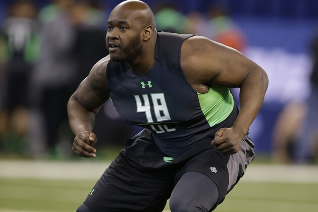 Mississippi offensive lineman Laremy Tunsil runs a drill at the NFL football scouting combine in Friday, Feb. 26, 2016, in Indianapolis. (AP Photo/Darron Cummings)