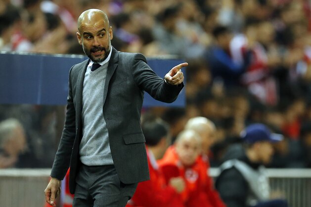 Bayern head coach Pep Guardiola gestures during the Champions League 1st leg semifinal soccer match between Atletico Madrid and Bayern Munich at the Vicente Calderon stadium in Madrid, Spain, Wednesday, April 27, 2016. (AP Photo/Paul White)