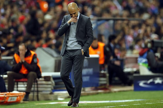 Bayern head coach Pep Guardiola reacts during the Champions League 1st leg semifinal soccer match between Atletico Madrid and Bayern Munich at the Vicente Calderon stadium in Madrid, Spain, Wednesday, April 27, 2016. (AP Photo/Paul White)