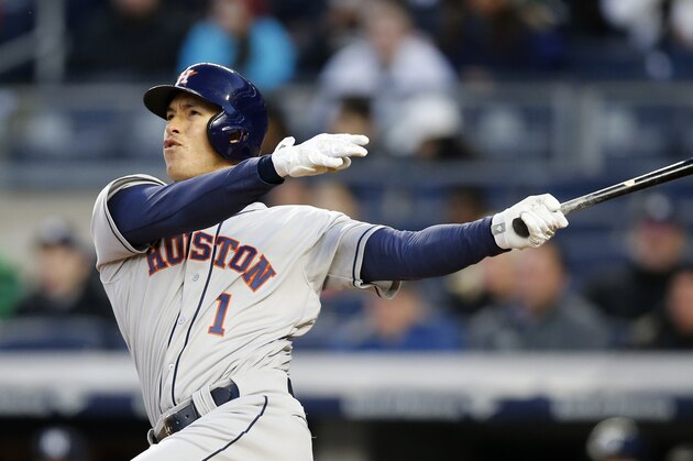 Houston Astros Carlos Correa (1) watches his first-inning, solo, home run off New York Yankees starting pitcher Michael Pineda in a baseball game in New York, Wednesday, April 6, 2016. (AP Photo/Kathy Willens)