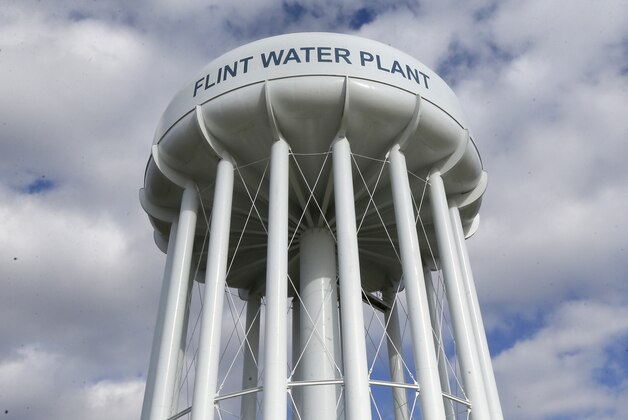 In this photo taken March 21, 2016, the Flint Water Plant water tower is seen in Flint, Mich. President Barack Obama next week will make his first trip to Flint, Mich. since the impoverished city was found to have lead-tainted drinking water, the White House said Wednesday, April 27, 2016.   (AP Photo/Carlos Osorio)