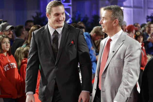 Ohio State defensive player Joey Bosa, left, and head coach Urban Meyer arrive at the College Football Awards presentation, Thursday, Dec. 11, 2014, in Lake Buena Vista, Fla. (AP Photo/John Raoux)