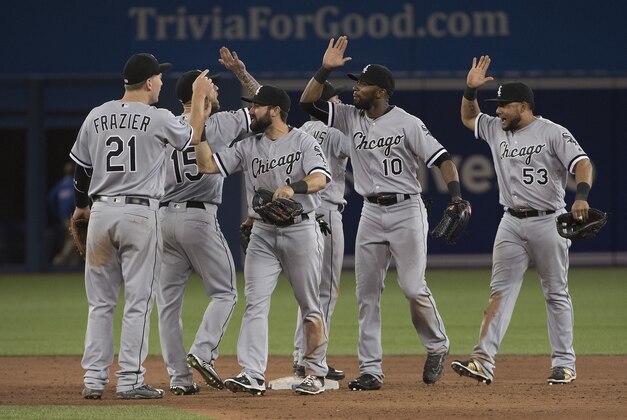 Apr 25, 2016; Toronto, Ontario, CAN; Chicago White Sox center fielder Adam Eaton (1) celebrates the win with third baseman Todd Frazier (21) at the end of a game against the Toronto Blue Jays at Rogers Centre. The Chicago White Sox won 7-5. Mandatory Credit: Nick Turchiaro-USA TODAY Sports