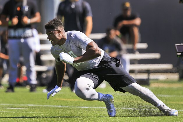 UCLA linebacker Myles Jack runs drills in the team's NFL football pro day at Spaulding Field in Los Angeles on Tuesday, March 15, 2016. (AP Photo/Damian Dovarganes)