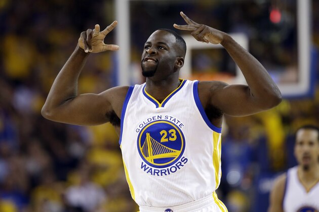 Golden State Warriors' Draymond Green (23) reacts after scoring against the Houston Rockets during the first half in Game 5 of a first-round NBA basketball playoff series Wednesday, April 27, 2016, in Oakland, Calif. (AP Photo/Marcio Jose Sanchez)