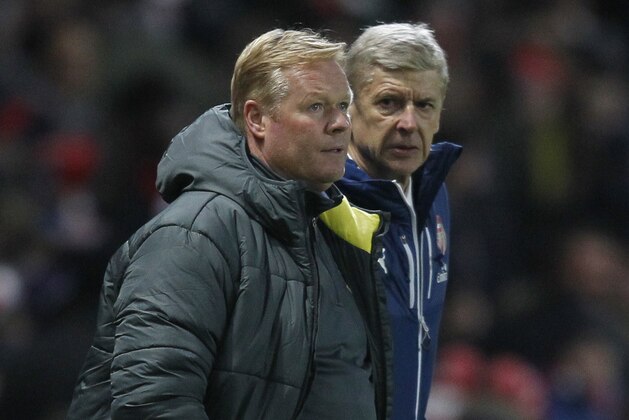Southampton's Dutch manager Ronald Koeman (L) and Arsenal's French manager Arsene Wenger (R) watch the action during the English Premier League football match between Arsenal and Southampton at the Emirates Stadium in London on December 3, 2014. Arsenal won the game 1-0.  AFP PHOTO/IAN KINGTON

RESTRICTED TO EDITORIAL USE. NO USE WITH UNAUTHORIZED AUDIO, VIDEO, DATA, FIXTURE LISTS, CLUB/LEAGUE LOGOS OR LIVE SERVICES. ONLINE IN-MATCH USE LIMITED TO 45 IMAGES, NO VIDEO EMULATION. NO USE IN BETTING, GAMES OR SINGLE CLUB/LEAGUE/PLAYER PUBLICATIONS.        (Photo credit should read IAN KINGTON/AFP/Getty Images)