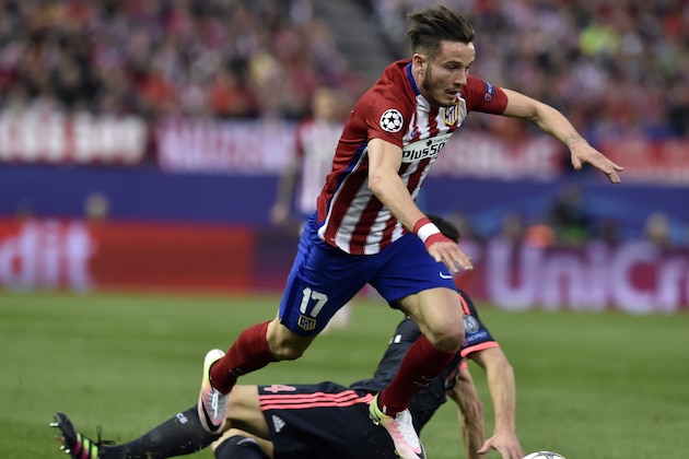 Atletico Madrid's midfielder Saul Niguez jumps over another player during the UEFA Champions League semi-final first leg football match Club Atletico de Madrid vs Bayern Munich at the Vicente Calderon stadium in Madrid on April 27, 2016. / AFP / GERARD JULIEN        (Photo credit should read GERARD JULIEN/AFP/Getty Images)