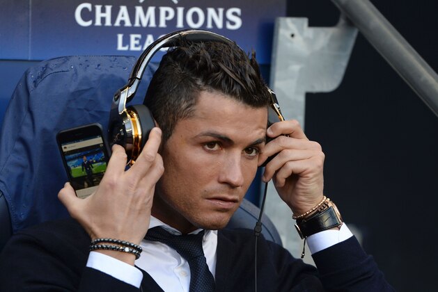 Real Madrid's Portuguese forward Cristiano Ronaldo sits in the dug-out ahead of kick off of the UEFA Champions League semi-final first leg football match between Manchester City and Real Madrid at the Etihad Stadium in Manchester, northwest England, on April 26, 2016.
Real Madrid superstar Cristiano Ronaldo was unexpectedly left out of the squad for his side's Champions League semi-final first leg at Manchester City on April 26. Ronaldo was declared fit by head coach Zinedine Zidane on April 25, despite having missed Saturday's 3-2 win at Rayo Vallecano with a thigh strain, and trained with his team-mates on the eve of the game. But he was not even included in the squad to face City, with Spanish winger Lucas Vazquez taking his place in the starting XI at the Etihad Stadium.
 / AFP / OLI SCARFF        (Photo credit should read OLI SCARFF/AFP/Getty Images)