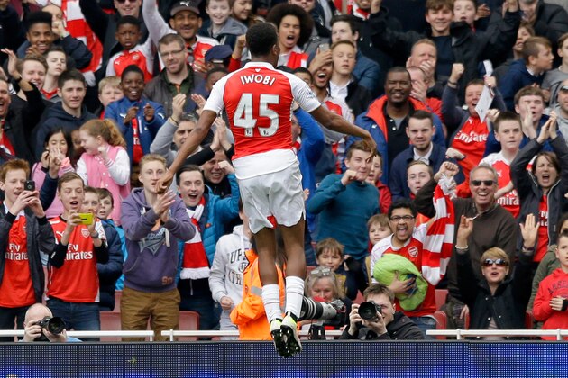 Arsenal's Alex Iwobi celebrates scoring his side's second goal during the English Premier League soccer match between Arsenal and Watford at the Emirates Stadium in London, Saturday, April 2, 2016.  (AP Photo/Matt Dunham)
