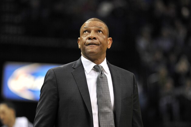 Los Angeles Clippers head coach Doc Rivers looks at the scoreboard during a timeout in the first half of an NBA basketball game Saturday, March 19, 2016, in Memphis, Tenn. (AP Photo/Brandon Dill)