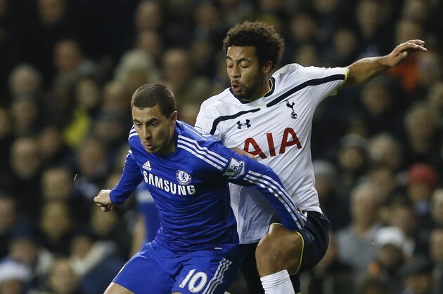 Tottenham's Mousa Dembele, right, vies for the ball with Chelsea's Eden Hazard during the English Premier League soccer match between Tottenham Hotspur and Chelsea at White Hart Lane Stadium in London, Thursday, Jan. 1, 2015. (AP Photo/Kirsty Wigglesworth)