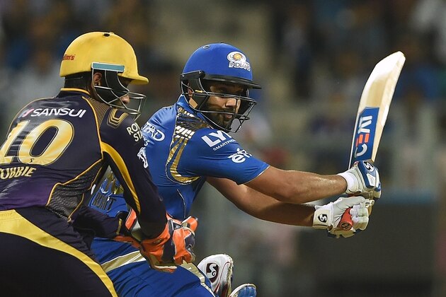 Mumbai Indians captain Rohit Sharma (R) plays a shot during the 2016 Indian Premier League (IPL) Twenty20 cricket match between Mumbai Indians and Kolkata Knight Riders at The Wankhede Cricket Stadium in Mumbai on April 28, 2016.ï¿½ï¿½ï¿½ï¿½ / AFP / PUNIT PARANJPE / ----IMAGE RESTRICTED TO EDITORIAL USE - STRICTLY NO COMMERCIAL USE----- / GETTYOUT        (Photo credit should read PUNIT PARANJPE/AFP/Getty Images)