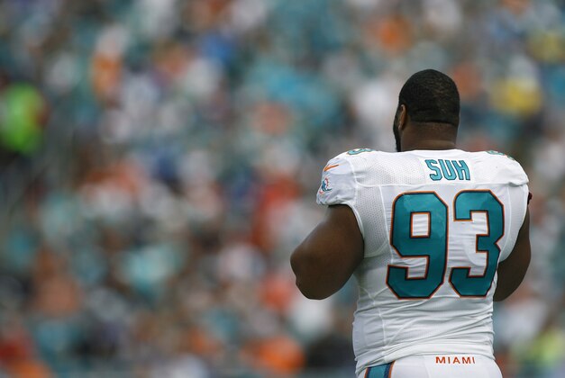 Dec 27, 2015; Miami Gardens, FL, USA;  Miami Dolphins defensive end Ndamukong Suh (93) looks on from the sidelines as the Dolphins play the Indianapolis Colts in the second half in at Sun Life Stadium. Mandatory Credit: Andrew Innerarity-USA TODAY Sports