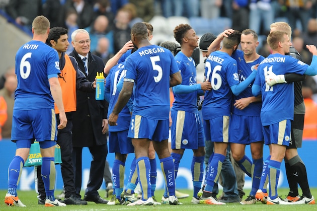 Leicester's manager Claudio Ranieri, 3rd left, celebrates with players at the end of the English Premier League soccer match between Leicester City and Swansea City at the King Power Stadium in Leicester, England, Sunday, April 24, 2016. (AP Photo/Rui Vieira)