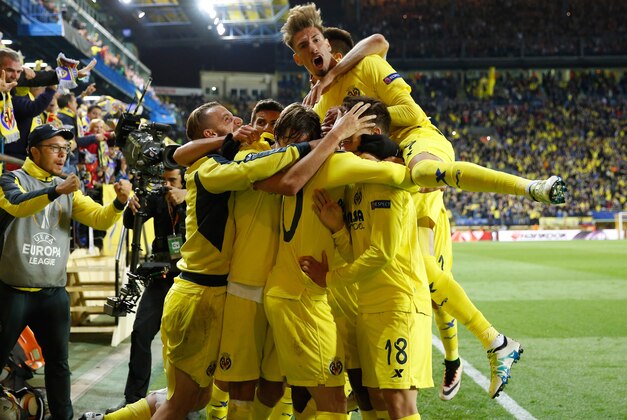 Villarreal players celebrate after scoring the opening goal during their Europa League semifinal first leg soccer match between Villarreal and Liverpool FC at the Madrigal stadium in Villarreal, Spain, Thursday April 28, 2016. (AP Photo/Alberto Saiz) Villarreal players celebrate after scoring the opening goal during their Europa League semifinal first leg soccer match between Villarreal and Liverpool FC at the Madrigal stadium in Villarreal, Spain, Thursday April 28, 2016. (AP Photo/Alberto Saiz)