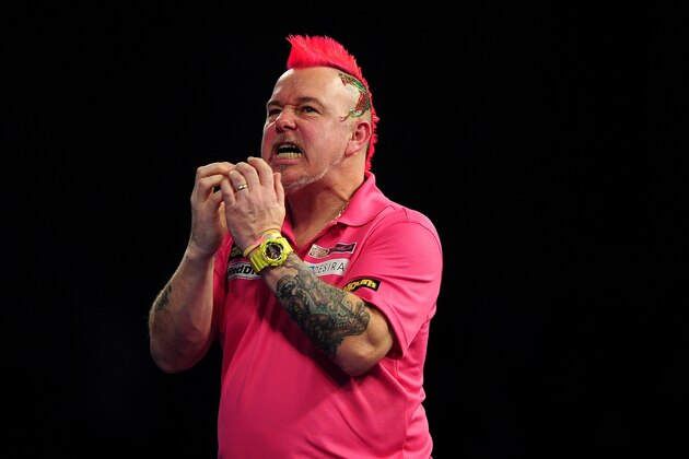 LONDON, ENGLAND - JANUARY 01:  Peter Wright of Scotland reacts after missing a dart against Adrian Lewis of England in their quarter final match during Day Thirteen of the 2016 William Hill PDC World Darts Championships at Alexandra Palace on January 1, 2016 in London, England.  (Photo by Dan Mullan/Getty Images)