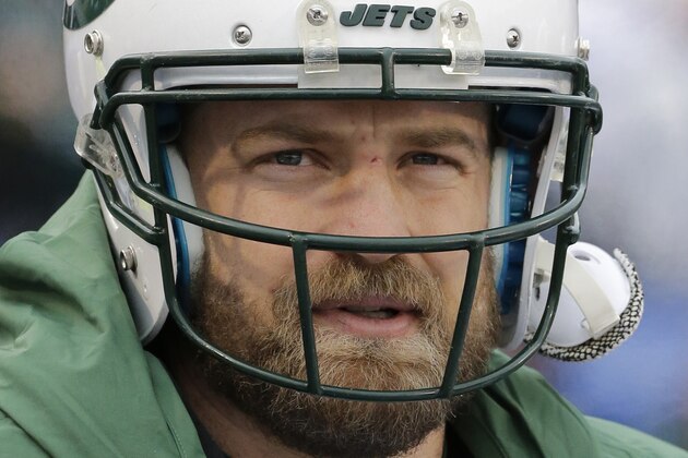 FILE - In this Jan. 3, 2016, file photo, New York Jets quarterback Ryan Fitzpatrick watches his team play during the second half of an NFL football game against the Buffalo Bills in Orchard Park, N.Y. Re-signing Fitzpatrick remains a