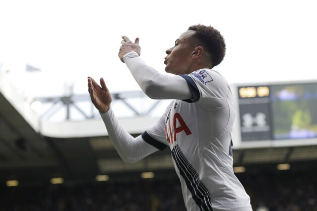 Tottenham Hotspur's Dele Alli blows kisses as he celebrates scoring his side's second goal during the English Premier League soccer match between Tottenham Hotspur and Manchester United at White Hart Lane stadium in London, Sunday, April 10, 2016. (AP Photo/Matt Dunham)