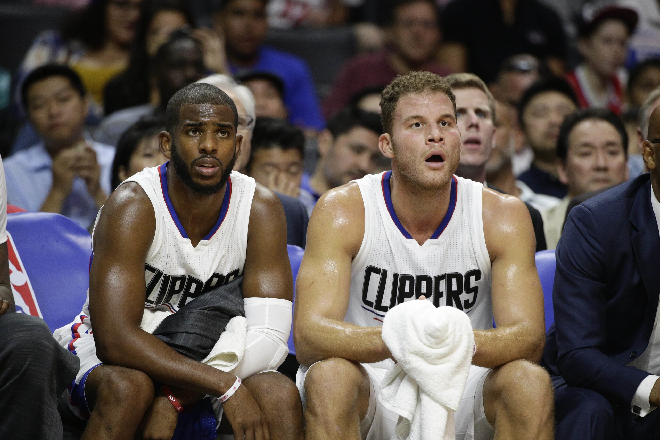 FILE - In this Oct. 20, 2015 file photo, Los Angeles Clippers' Chris Paul, left, and Blake Griffin watch from the bench during the first half of an NBA preseason basketball game against the Golden State Warriors, in Los Angeles. Without injured stars Chris Paul and Blake Griffin, the banged-up Los Angeles Clippers try to take a 3-2 lead over the Portland Trail Blazers in Game 5 of their first-round series, Wednesday, April 27, 2016. (AP Photo/Jae C. Hong, File)